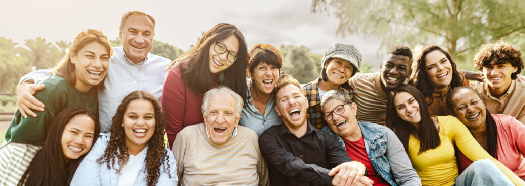 A group of people smiling, laughing, and enjoying their day.